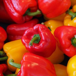 organic sweet bell peppers red and orange in colour in a pile