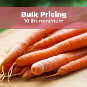 orange carrots in a pile on a table with a banner that reads bulk pricing 10 lbs minimum